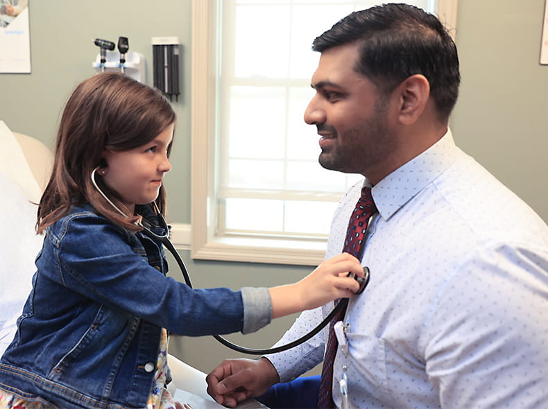 an image of a doctor with a young patient