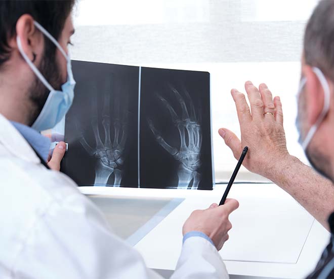 Rheumatologist explaining a patience's injury  