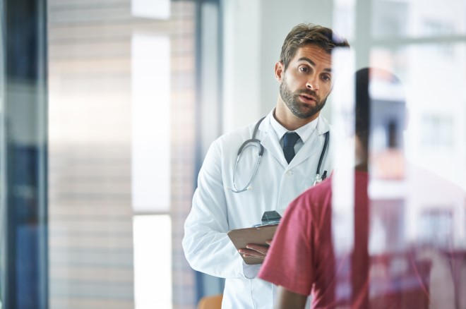 An image of a doctor talking to a patient 