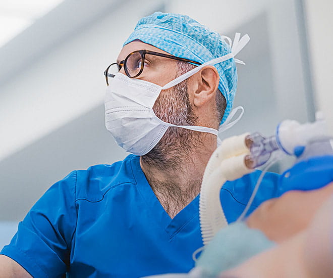 A surgeon provides a life-saving procedure to a critically ill patient.