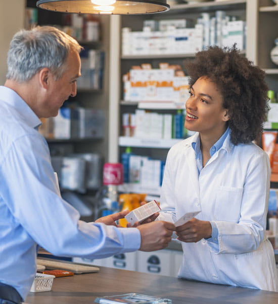 man receiving medication from pharmacy