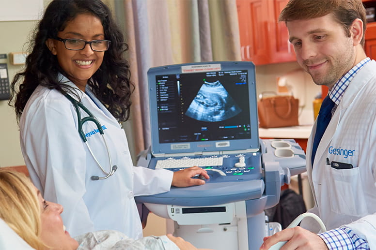 Better begins with all of us - Doctors looking at an ultrasound