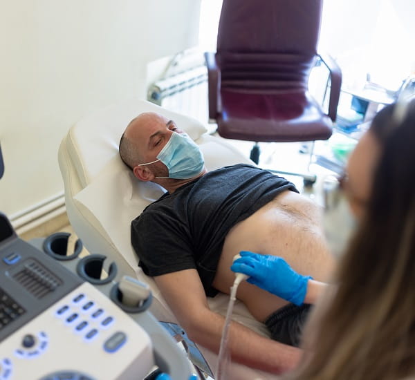 A man receiving a nephrology ultrasound